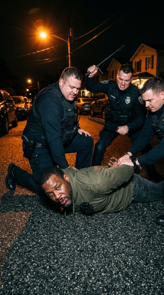 Man_pinned_by_police_officers_202605160052